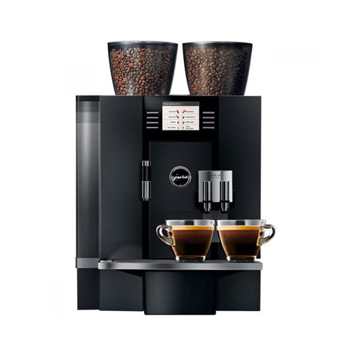 Automatic espresso machine brewing coffee with fresh beans and frothing milk.